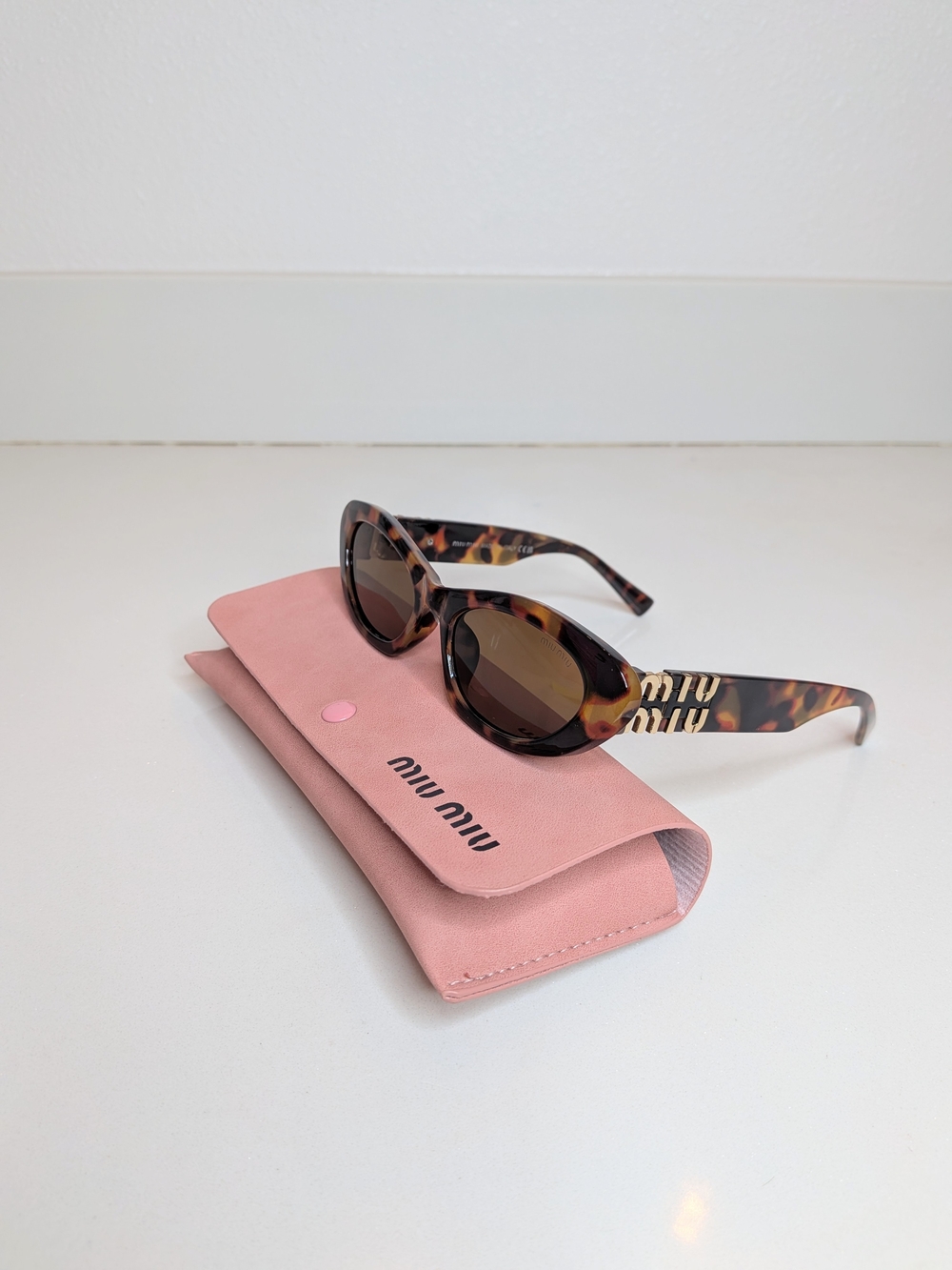 Miu Miu Tortoiseshell Cat-Eye Sunglasses with Pink Case